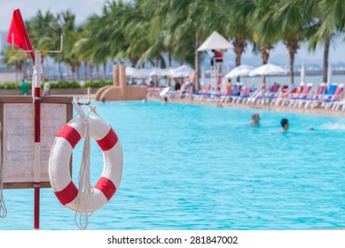 Red Lifebuoy Near Public Swimming Pool.