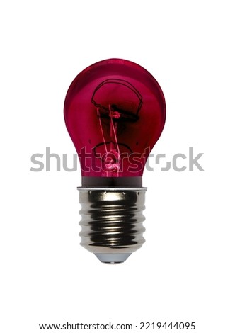 Red light bulb negative effect uses a lot of energy with a tungsten filament screwed in thread on a white background - symbolizing the resignation from this technology in favor of LED diodes - E40