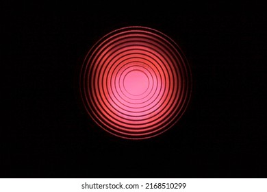 Red light with concentric circles on fresnel lens