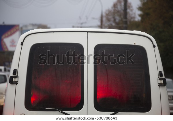 Red light into\
a car. Close up of a back\
car.