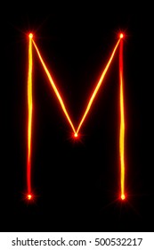 Red Light Painting Letter M On Black Background