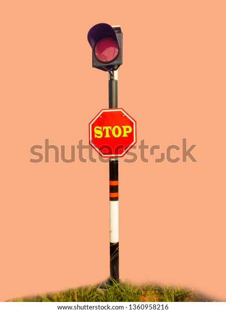 Red light and stop sign Installed along the
intersection To stop the car first To harm each other On a light
red background