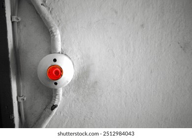 red light switch on the wall in the hallway