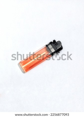 red lighter on a white background