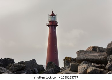 red lighthouse in Andenes at the beginning of National Tourist Route Andøya in Lofoten in Norway