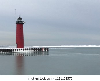 Red Lighthouse On Blue Cloud Sky In Winter At Michigan Lake In Kenosha, Wisconsin, USA.