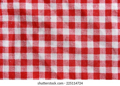 Red Linen Crumpled Tablecloth. Texture Of A Red And White Creased Picnic Blanket.