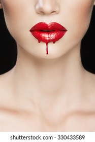 Red lips close-up, make up dripping
