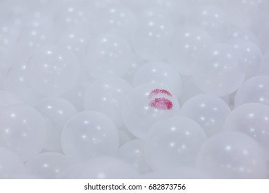 Red Lips Printed On White Plastic Balls