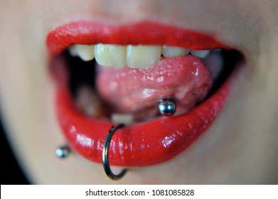 Red lips of a Woman with piercings