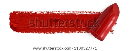 Red lipstick bullet smudged isolated on white with copy space