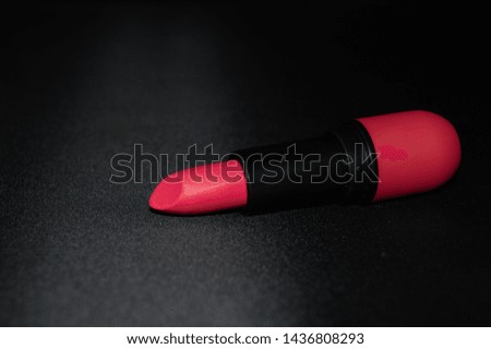 red lipstick, dark background, close up photo