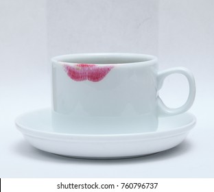 Red Lipstick Mark On A Tea Coffee Cup