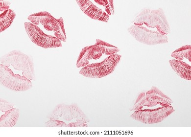 Red Lipstick Marks On A White Background. Kiss Symbol. Minimal Love Concept.Flat Lay.