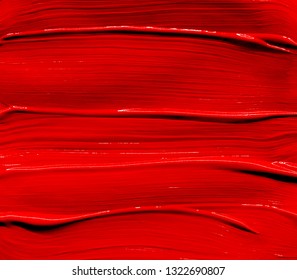 Red Lipstick Smudged Background. Lipstick Or Other Makeup Product Swatch. Acrylic Paint Smeared Texture. Red Gouache Brush Painted Wallpaper. Can Be Used As An Advertisement Banner, Text Background.