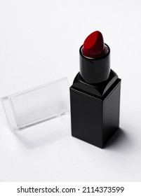 Red Lipstick Tube On  White Background. Beauty Industry Concept