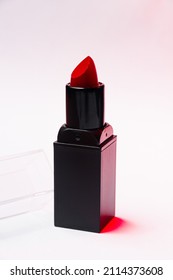 Red Lipstick Tube On  White Background. Beauty Industry Concept