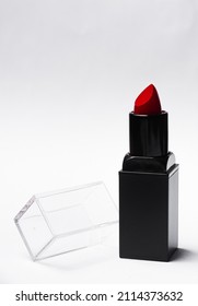 Red Lipstick Tube On  White Background. Beauty Industry Concept