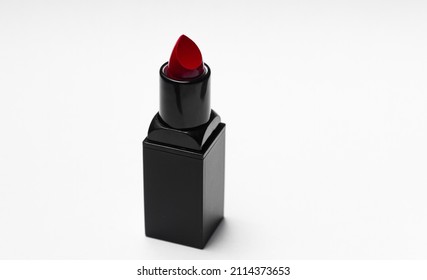 Red Lipstick Tube On  White Background. Beauty Industry Concept