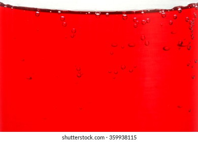 Red Liquid  In Glass On White Background