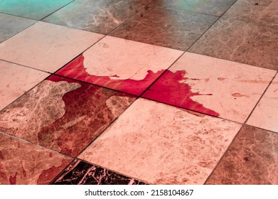 Red Liquid On The Tile Floor. Selective Focus