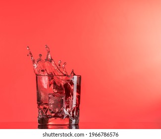 Red Liquid Spash With A Red Background