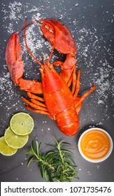 Red Lobster On Old Black Slate Tray With Salt And Lime, Top View, Overhead