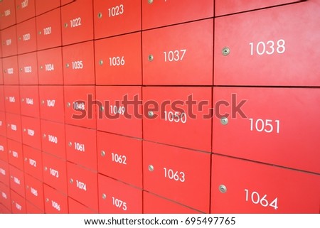 red locker mailbox at post office with numbers
