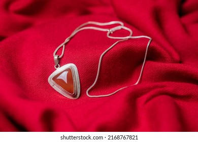Red locket in red background