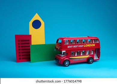 A red London bus, a Big Ben clock and a cellphone made of paper.