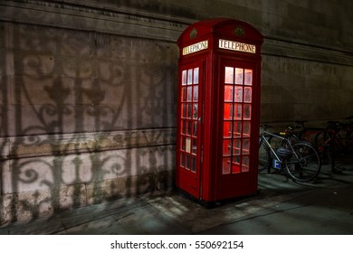 Red London Telephone Box at night. - Powered by Shutterstock