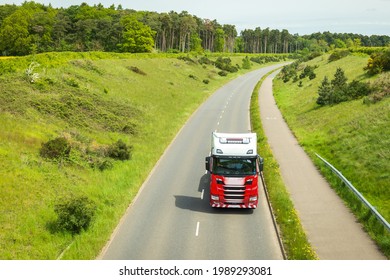 Red Lorry Truck On Uk Motorway Road In England.