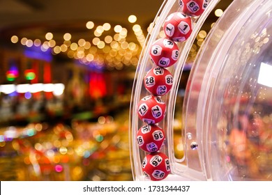Red lottery balls in a bingo machine.Gambling machine and euqipment.