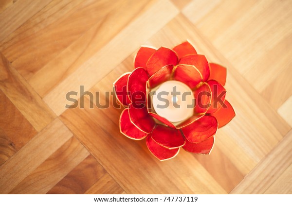 Red Lotus Candle Holder On Wooden Royalty Free Stock Image