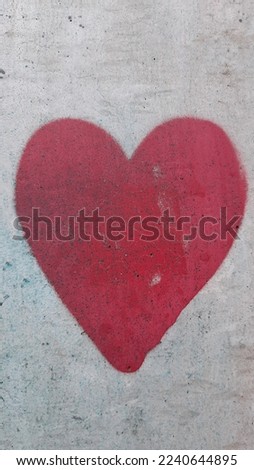 Similar – UT Only floating is more beautiful I Painted heart on the house wall