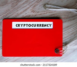 Red Luggage Tag With Text CRYPTOCURRENCY, Form Of Currency That Exists Digitally Or Virtually And Uses Cryptography To Secure Transactions