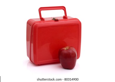 A Red Lunchbox With An Apple Isolated On White, Healthy School Lunch