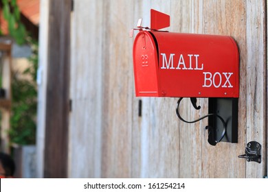 Red Mail Box On Wood Texture