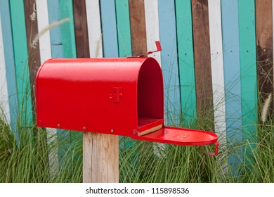 Red Mail Box On Wooden Wall