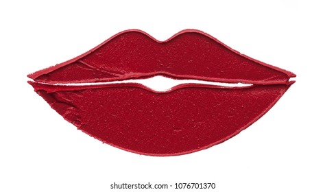 Red makeup smear of matte lip gloss in the form of lips isolated on white background. Red creamy lipstick texture isolated on white background