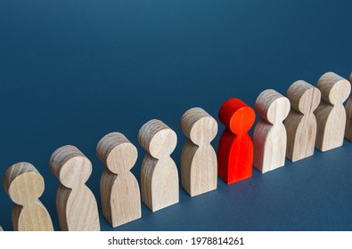 Red man in a crowd. Stranger, eye-catching. Different, special. Infected carrying threat of pandemic spread. Social distance. Intruder detection. Coming out. Be different. Collective immunity. - Shutterstock ID 1978814261
