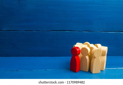 Red man stands out from group, Crowd, meeting, social activity. Group people figurines. Society, social group. Herd instinct, management of people. Human resources, workers stand together.