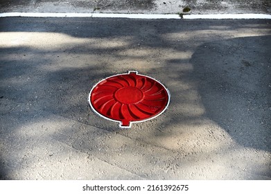 
A Red Manhole. Safety On The Road. Warning Danger. Red Circle.