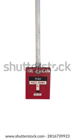 Red manual pull station fire alarm box with push and pull down switch mounted connected to a metal electrical conduit pipe