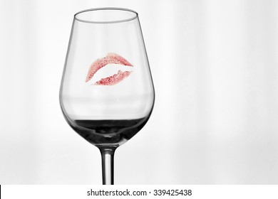 A Red Mark Of A Lipstick On A Glass.