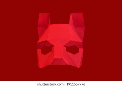 Red Mask On A Red Background. Stylish And Beautiful Red Animal Mask With Ears On A Red Background. Mask Of A Wolf, Fox, Dog, Cat.