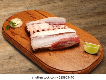red meat on wooden table ready to cook - Shutterstock ID 215903470