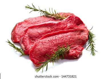 A Red Meat With  Rosemary Isolated On White Background