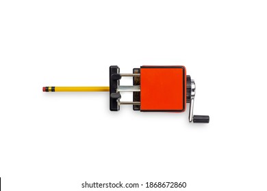 Red Mechanical Pencil Sharpener With Yellow Pencil Isolated On A White Background. Top View.