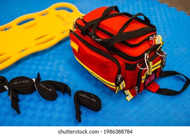 Red Medical Bag And First Aid Kit On Blue Background